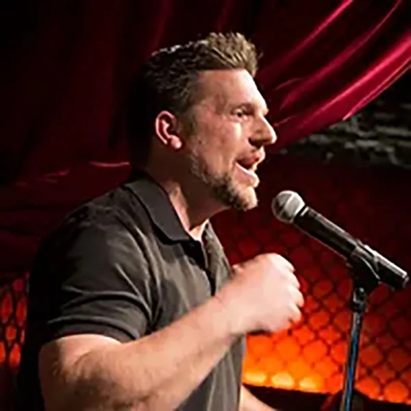 Matt Jones, host, speaking on stage