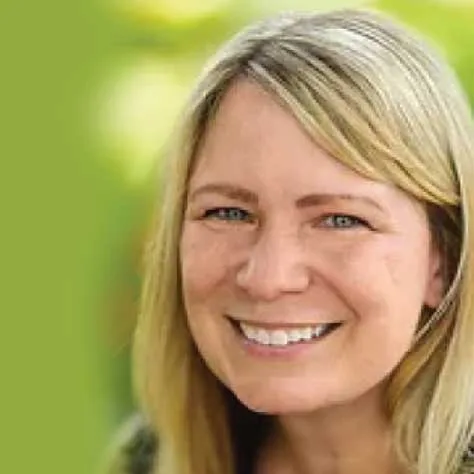 Erica Katz, producer, smiling outdoors