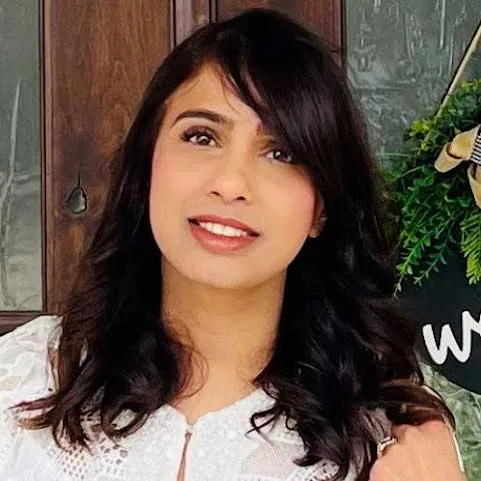 Simi Krishnan, producer, outdoors on a rocky trail